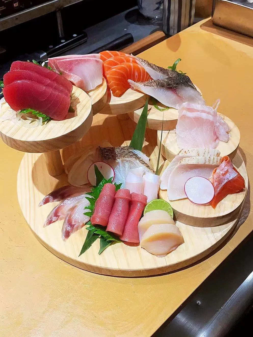 Assorted Sashimi Platter showcases an array of fresh raw fish slices, including tuna, salmon, and other varieties at Kokoro Sushi, a Japanese restaurant in CA