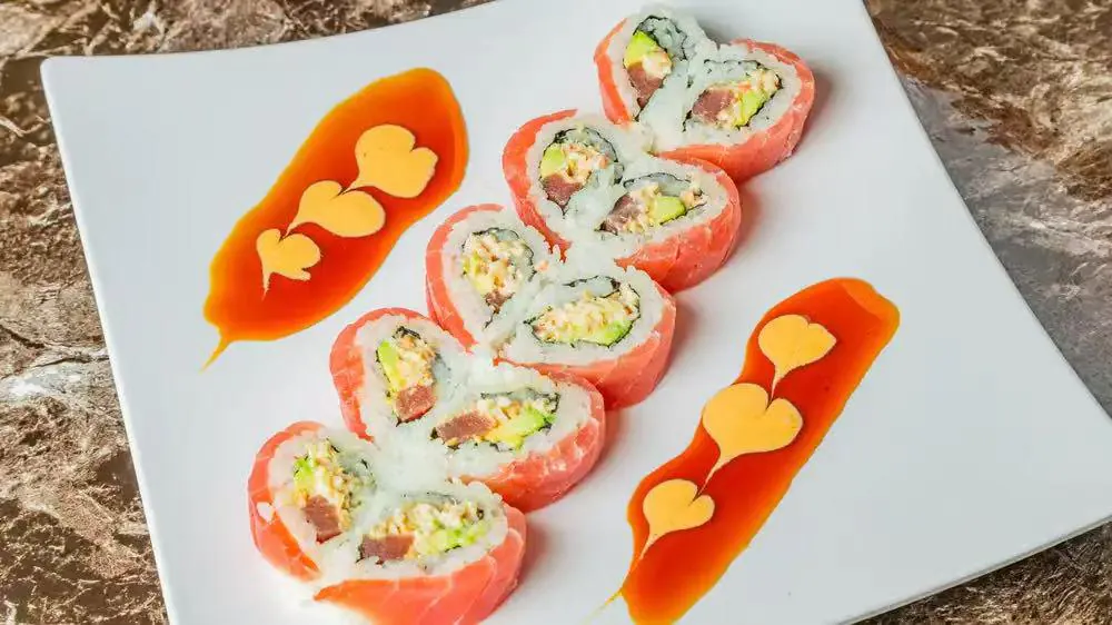 Heart - Shaped Tuna Sushi Roll features sushi rolls shaped like hearts, filled with tuna, avocado, and other ingredients at Kokoro Sushi, a Japanese restaurant in CA