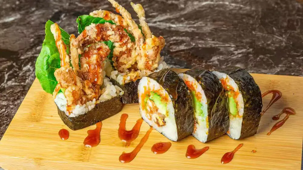 Tempura Squid Sushi includes sushi topped with tempura - fried squid, avocado, and other fillings at Kokoro Sushi, a Japanese restaurant in CA